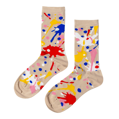 Tan crew socks featuring colorful paint splatter in red blue yellow pink and white by Yellow Owl Workshop