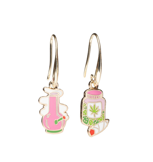 Mismatched enamel drop earrings featuring pink bong with smoke clouds and cannabis jar with leaf label and joint by Yellow Owl Workshop