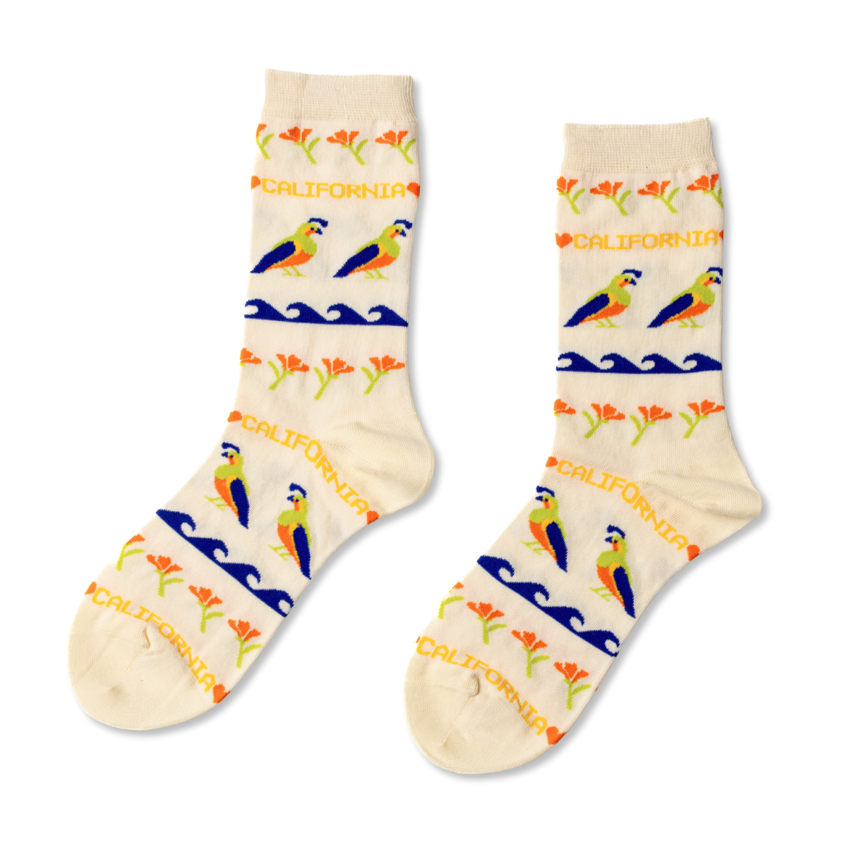 Cream crew socks featuring California quail golden poppies and coastal waves in cross-stitch inspired pattern by Yellow Owl Workshop