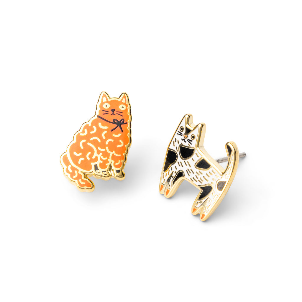 Mismatched gold stud earrings featuring fluffy orange tabby cat and black and white tuxedo cat by Yellow Owl Workshop
