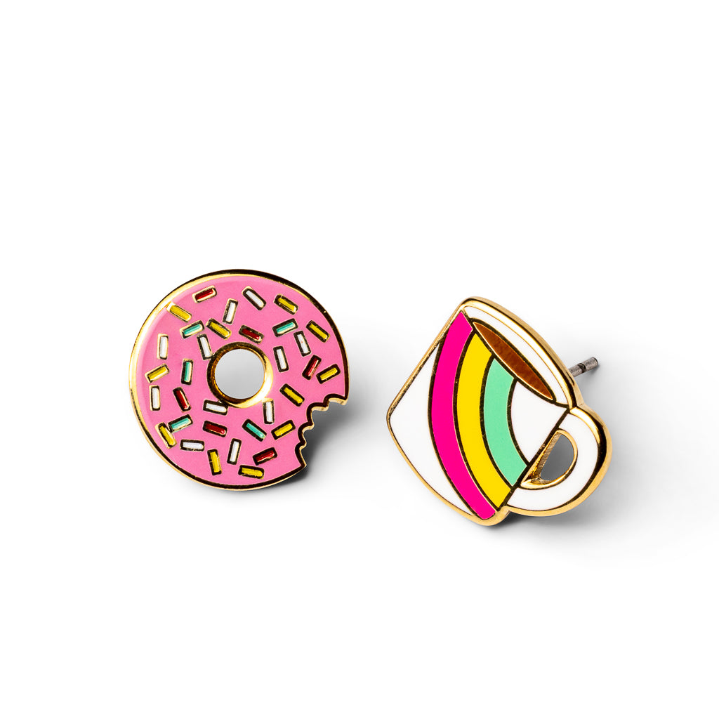 Mismatched gold stud earrings featuring pink sprinkle donut with bite taken out and rainbow striped coffee mug by Yellow Owl Workshop