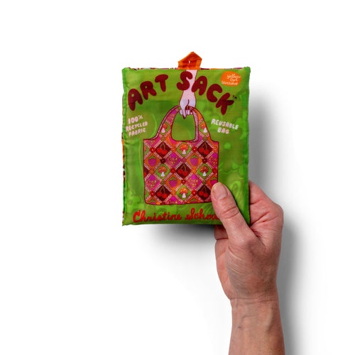 Person holding illustrated funny retro tote bag with vintage fruit and mushroom print by Yellow Owl Workshop