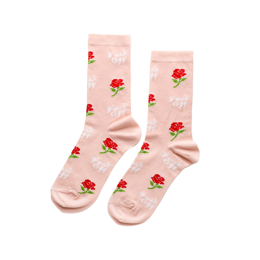 Blush pink crew socks featuring red roses and F*ck Off text in white lettering by Yellow Owl Workshop