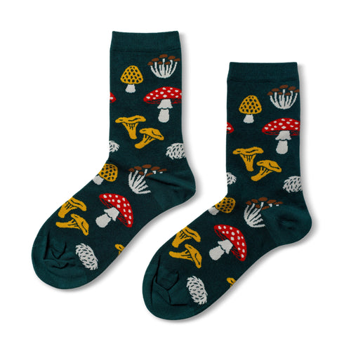 Dark green crew socks featuring illustrated forest mushrooms including amanita chanterelle and hen of the woods by Yellow Owl Workshop