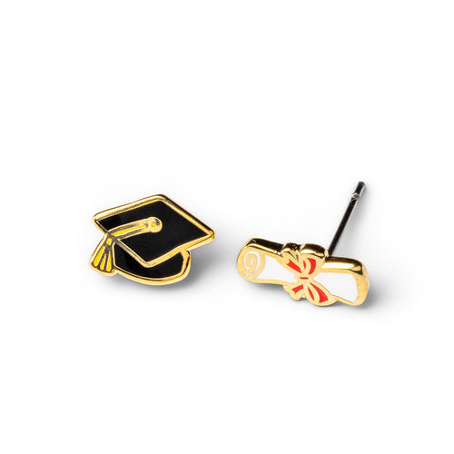 Mismatched cloisonné stud earrings featuring black graduation cap and gold diploma with red ribbon gilded in 22 karat gold by Yellow Owl Workshop