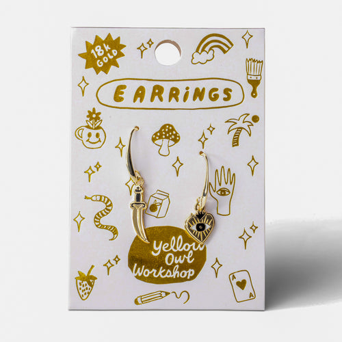 Heart and Dagger mismatched enamel drop earrings on gold foil matchbook card by Yellow Owl Workshop