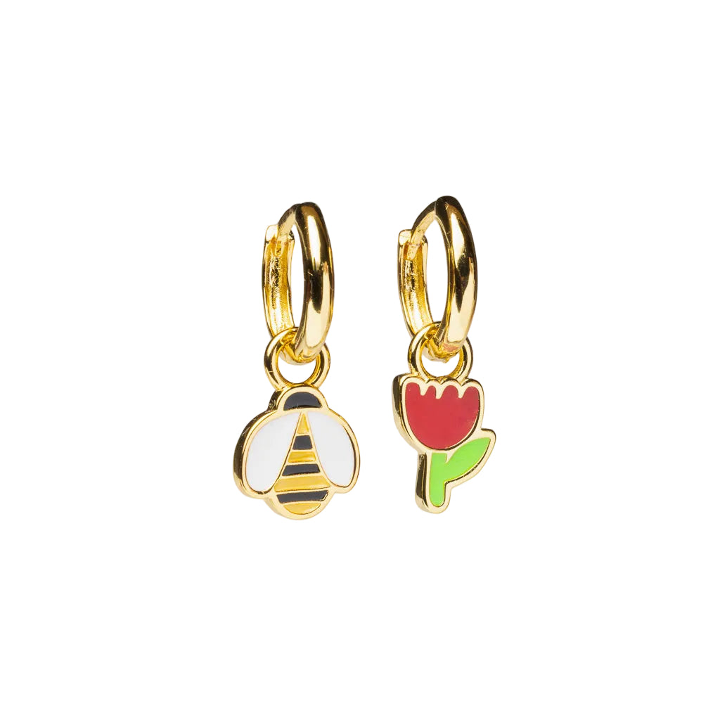 Gold hoop earrings with bee and tulip charms on a white background