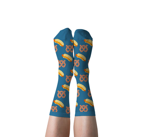 Blue and orange Hot Dog and Pretzel crew socks with illustrated stadium snacks worn on feet by Yellow Owl Workshop