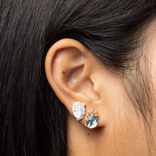 Matisse inspired mismatched cloisonné stud earrings worn on ear by Yellow Owl Workshop