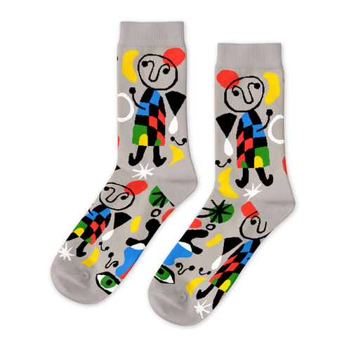 Grey crew socks featuring bold Miro-inspired surrealist figures and abstract shapes in red yellow blue and black by Yellow Owl Workshop