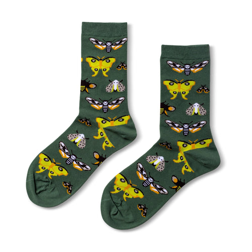 Green crew socks featuring illustrated moth varieties in yellow orange and grey by Yellow Owl Workshop
