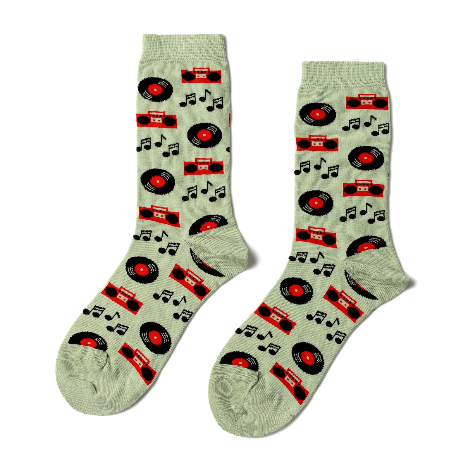Light sage green crew socks featuring illustrated vinyl records orange boomboxes and music notes by Yellow Owl Workshop