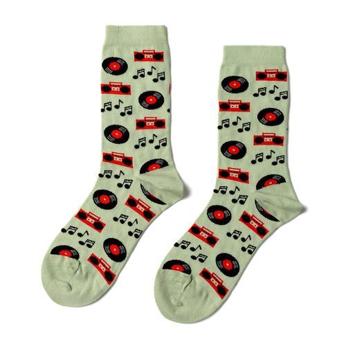 Light sage green crew socks featuring illustrated vinyl records orange boomboxes and music notes by Yellow Owl Workshop
