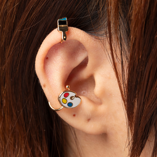 Gold paint brush and palette no-piercing ear cuffs worn on ear by Yellow Owl Workshop