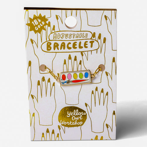 Colorful enamel paint set charm bracelet on gold foil packaging card by Yellow Owl Workshop
