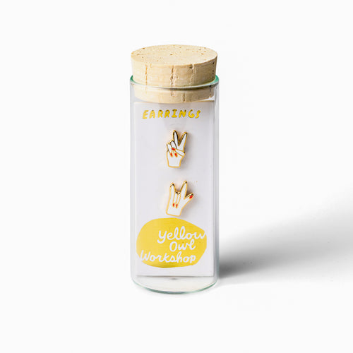 Peace and Love mismatched gold stud earrings in gift-ready glass vial by Yellow Owl Workshop