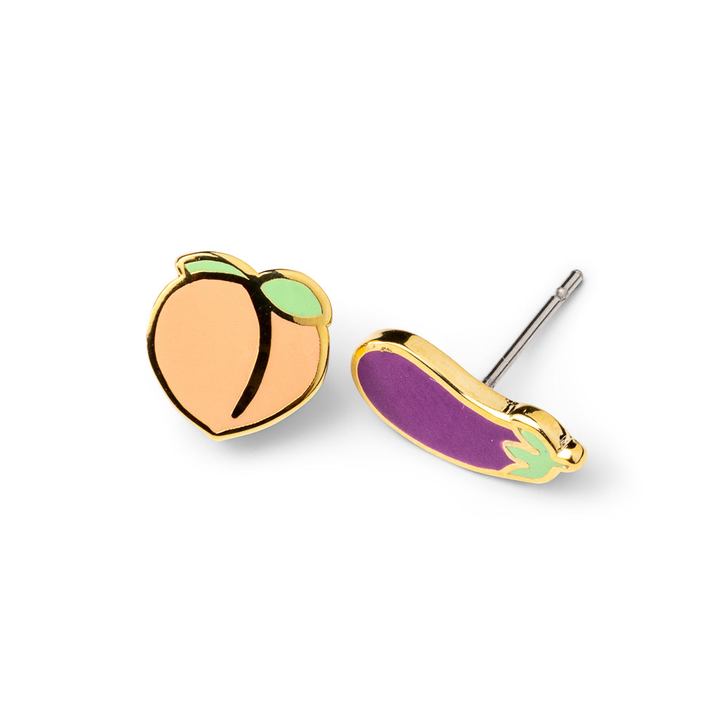 Mismatched cloisonné stud earrings featuring peach and eggplant emoji gilded in 22 karat gold by Yellow Owl Workshop