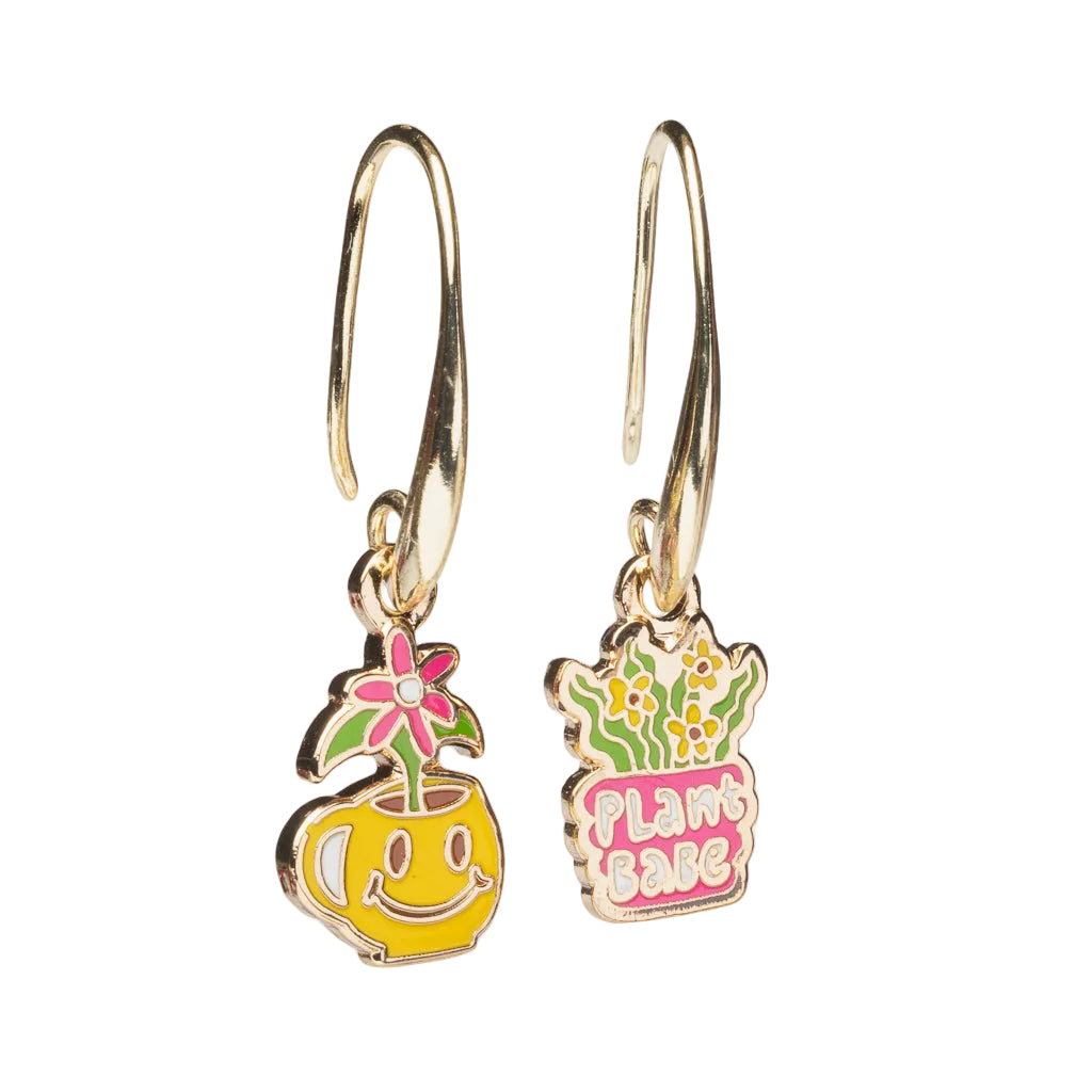 Mismatched enamel drop earrings featuring yellow smiley face mug with pink flower and Plant Babe plant pot by Yellow Owl Workshop