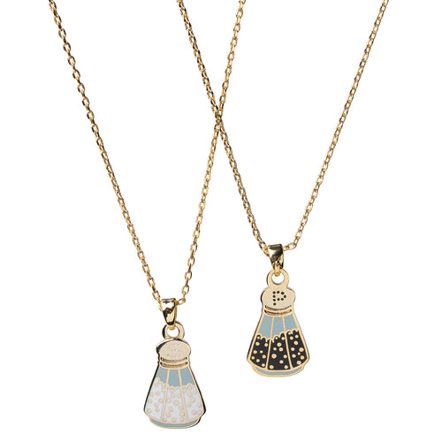 Double-sided enamel pendant necklace showing salt shaker side and pepper shaker side on 18k gold chain by Yellow Owl Workshop