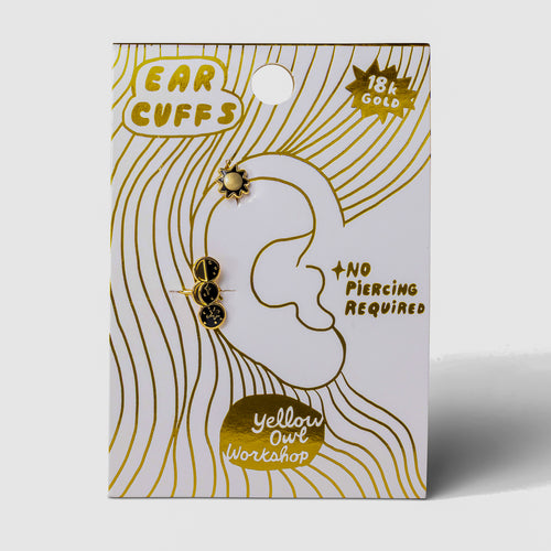 Sun and Moon Phases no-piercing gold ear cuffs on gold foil matchbook card by Yellow Owl Workshop