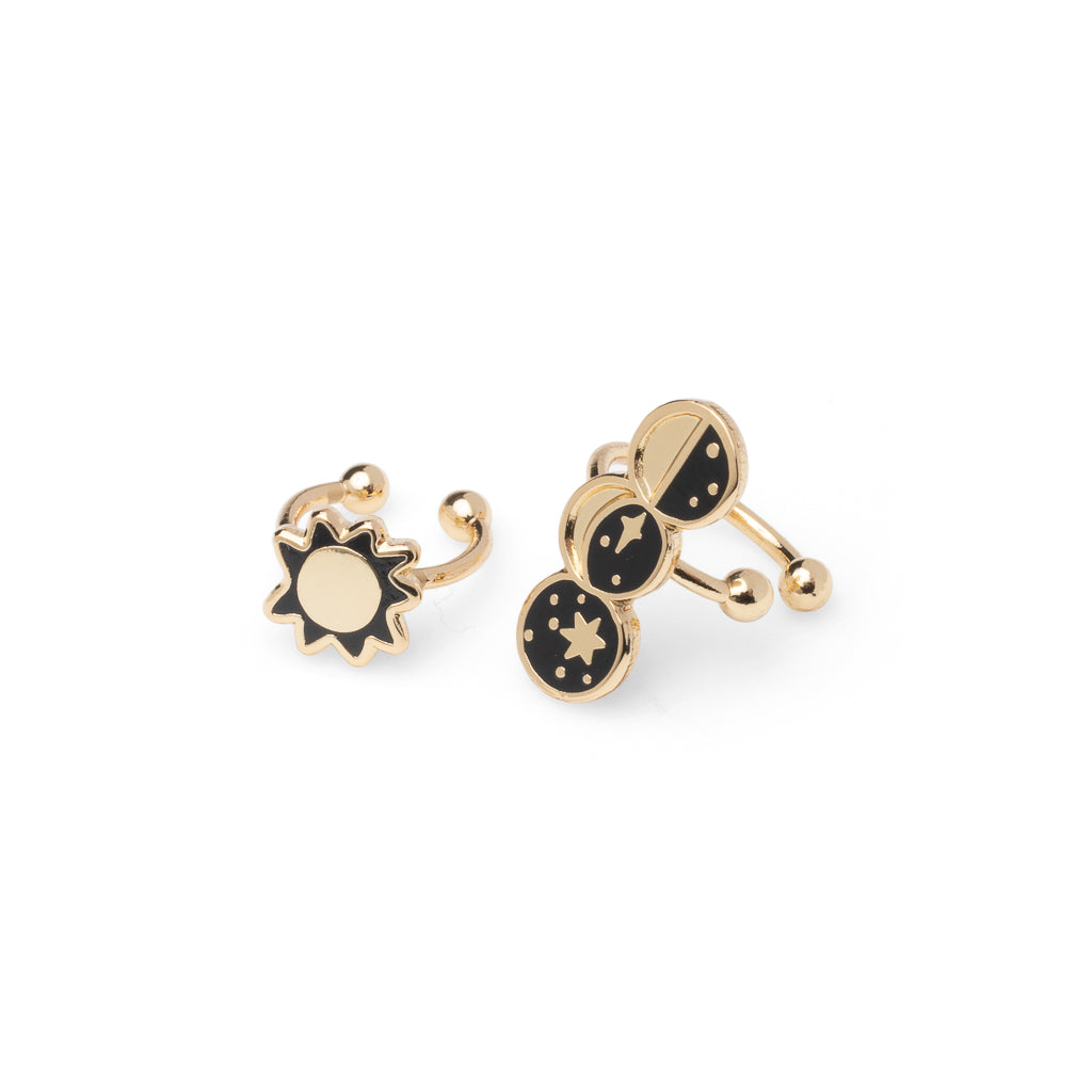 Mismatched gold sun and moon phases no-piercing ear cuffs featuring sun and half crescent and new moon by Yellow Owl Workshop
