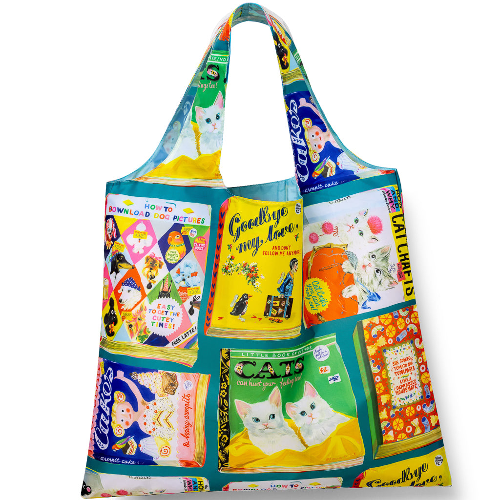 Illustrated reusable tote bag covered in colorful vintage style useless book cover illustrations by Anna Hoyle for Yellow Owl Workshop