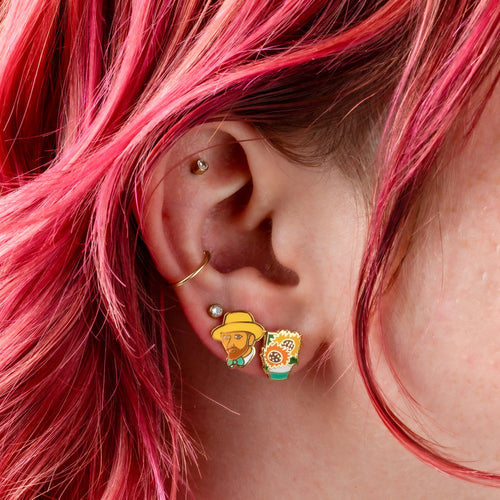 Van Gogh inspired mismatched cloisonné stud earrings worn on ear by Yellow Owl Workshop