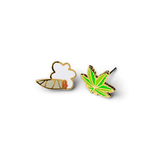Mismatched gold stud earrings featuring lit joint with smoke cloud and bright green cannabis leaf by Yellow Owl Workshop