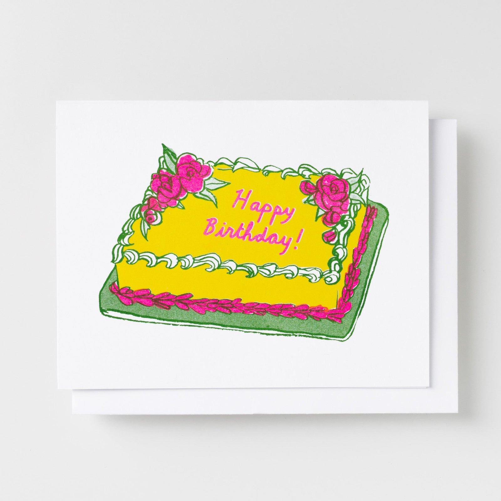 Risograph greeting card illustrated with a yellow sheet cake decorated with pink roses and green frosting, text reads Happy Birthday in pink cursive script